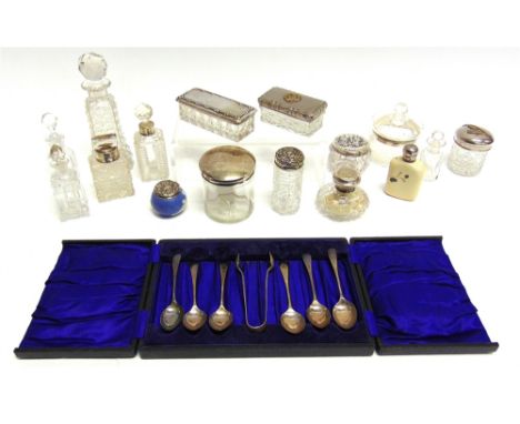 A CASED SET OF SIX SILVER TEASPOONS with sugar tongs; with seven toilet bottles with silver covers; 129g gross; three toilet 