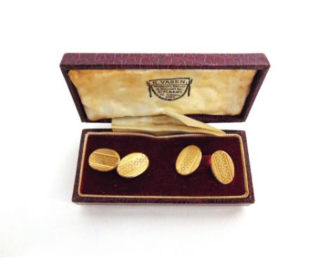 A PAIR OF CUFFLINKS stamped '9ct Gold', the oval engine turned panels with chain connectors, 5.5g gross, cased