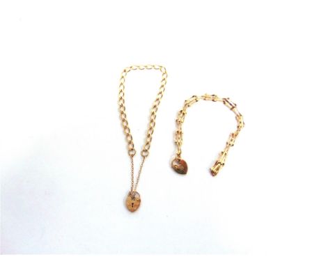 A 9 CARAT GOLD FILED CURB LINK BRACELET and a 9 carat gold three bar gate link bracelet; 7.3g gross