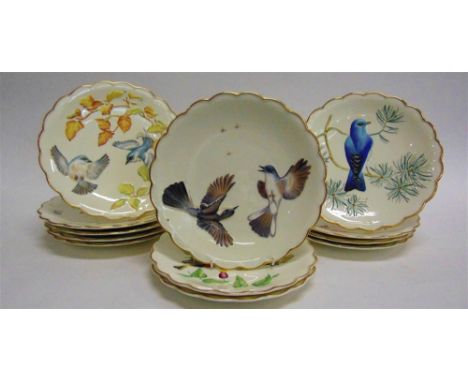 A SET OF TWELVE ROYAL WORCESTER CABINET PLATES  'The Birds of Dorothy Doughty Dessert Plates', 23.5cm diameter (one damaged)
