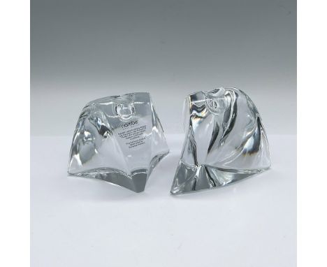 A set of 2 full-lead crystal candle holders in a curved abstract form. Nambe sticker and engraved marking. This item has its 