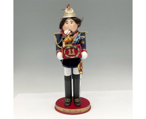 Figural designed with military dress with gilt braiding on his epaulets and carrying his sword and box with dancing lady. Mad