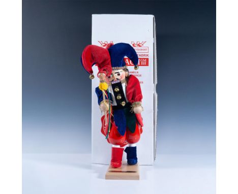 Limited edition 5445 of 7500; handcrafted and hand painted Christmas figure of a fool in a red, blue and green attire, holdin