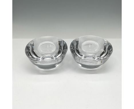 Round clear slanted crystal with center holder. Orrefors mark. Issued: 21st centuryDimensions: 2.5"H x 4" dia. Manufacturer: 