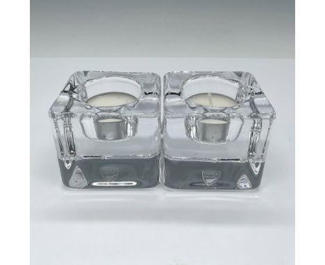 The Ice Cube Votive candle holder enhances the unique refractive qualities of crystal by shaping it into a massive cube, crea