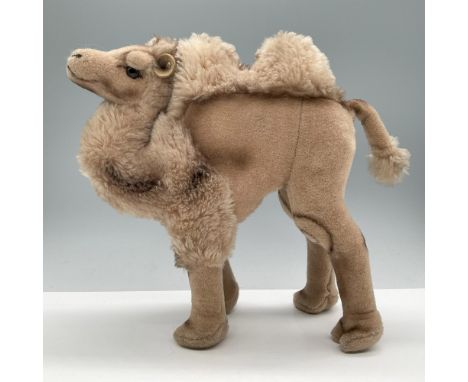 Made from Dralon, a soft and cuddly synthetic fur, has short tan fur on the body and long tan fur on the humps, chest, front 