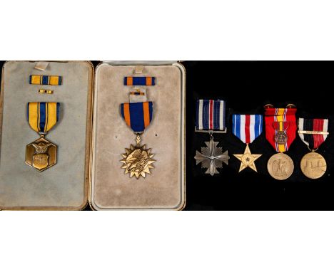 USA: Air Medal in official case of issue with riband bar and lapel ditto; Military Merit medal as previous; Distinguished Fly