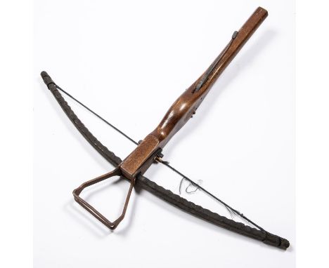 A reproduction of a mediaeval style crossbow, varnished wood stock 27", steel bow and mechanism. GC £50-70 