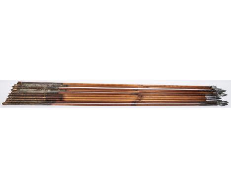 An 18th century Indian arrow, with flat figure of eight head; a set of three similar arrows with triangular section heads, th