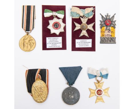 Seven Imperial German Veterans' medals: 25 year Veterans' Association Cross; similar unofficial 25 year star; gilt and enamel