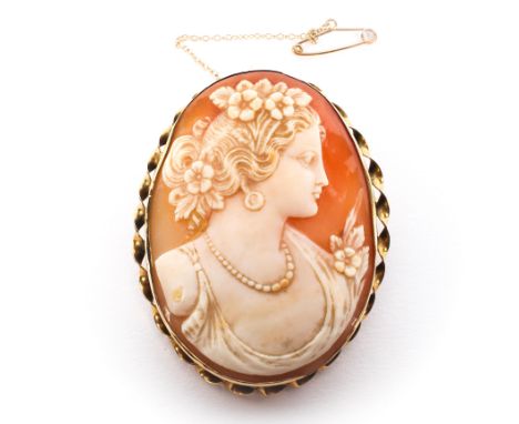 A 9ct gold mounted cameo brooch, with finely detailed bust portrait of a classical lady, with ribbon bordern to mount, 52mm x