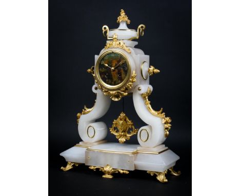 A French alabaster and gilt metal mantle clock, the metal dial with Arabic numerals and painted with a lakeside scene and mar
