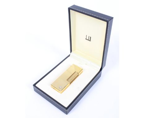 A gold plated Dunhill Rollagas lighter in original box. 