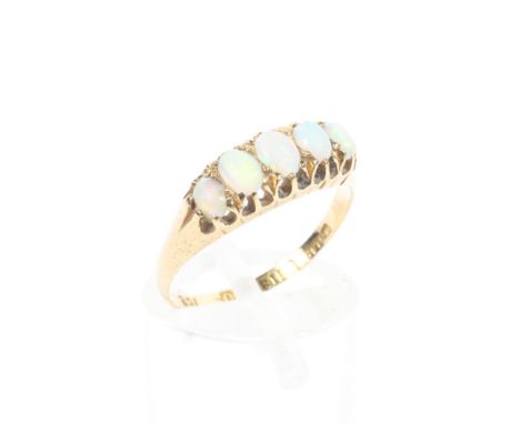 An 18ct gold five stone opal dress ring, draws colour, featuring five graduated stones, 2.2g, size M Condition Report: Some w