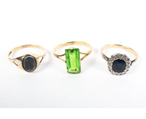 Three ladies gem set dress rings, one an 18ct gold sapphire and diamond chip ring, 1.6g, size K, together with two 9ct gold r