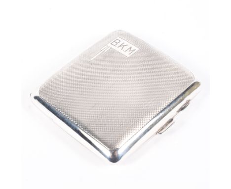 An mid century silver cigarette case, of square form with engine turned decoration throughout, engraved initials "BKM" to fro