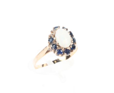 A 15ct gold opal and sapphire dress ring, (one sapphire missing), size M, 1.9g