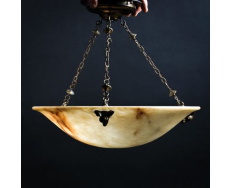 An early 20th century gilt-metal mounted alabaster plafonnier ceiling light shade, with three ram's masks suspending chains f