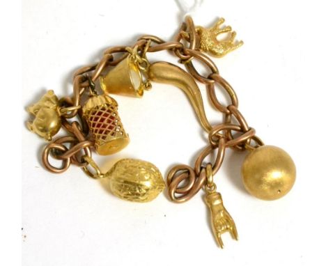 Charm bracelet set with eight charms including a pearl in a bucketStamped '9' and '.375', 29.1g gross.