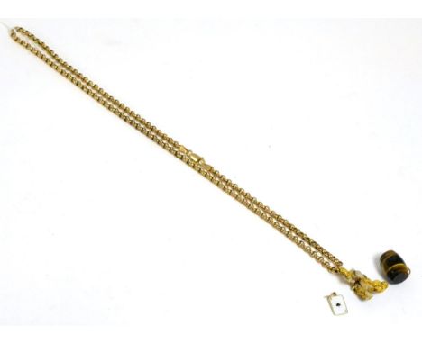 A 9ct gold chain with nugget pendant, a tiger's eye barrel shaped charm and a 9ct gold and enamel playing card charm (3)Chain