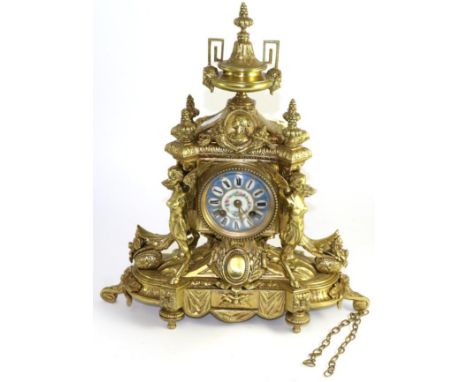 An ormolu striking mantel clock, circa 1890, the elaborate case with floral and figural mounts, enamel dial with Roman numera