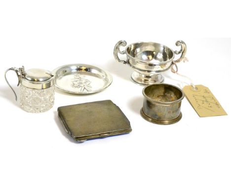 A silver and enamel compact, silver dish, silver small trophy cup, silver topped mustard and a silver napkin ring3.6ozt