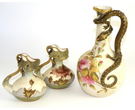 A Royal Worcester blush grand bottle vase, adorned with entwined serpent in relief, embellished with flowers and gilt, marks 