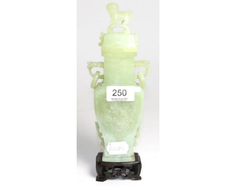 A jade type vase in archaic style, the lid surmounted by a dog of foe, 23cm high Very minor surface abrasions. 