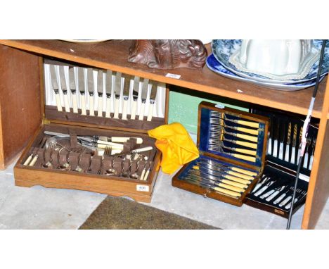 An oak cased canteen of silver plated flatware, a cased set of mother-of-pearl fruit knives and forks and a cased set of silv