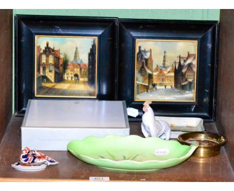 A collection of ceramics comprising a pair of painted tiles, Dutch townscapes, ebonised frames, a Copenhagen cockerel and 198