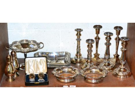 Assorted silver plate to include Old Sheffield plate candlesticks; a pair of wine coasters; electroplated entree dishes etc 