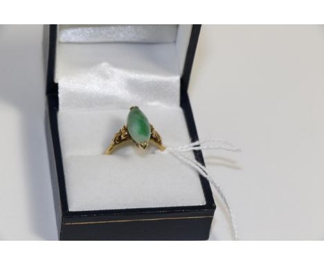 A jade ring stamped '22k'Finger size N, 4.2g gross.