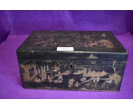 An oriental lacquered tea caddy having gilt detailing.AF