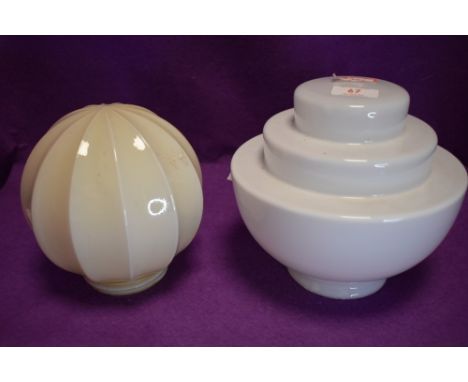 Two vintage glass lamp shades, both interesting shapes.
Both have slight paint scrtaches on which should clean off and small 