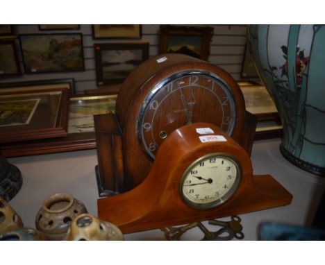 A Naploeon style mantle clock having inlayed veneer case 8 days Swiss made and similar Art Deco Smiths styled clock
Condition