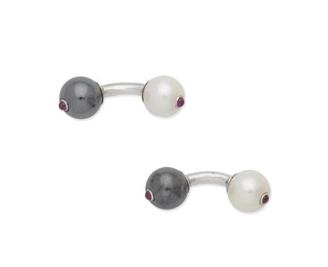 CULTURED PEARL AND RUBY CUFFLINKSDouble-sided, each 11.1mm pearl opposite a haematite sphere inlaid with circular ruby caboch