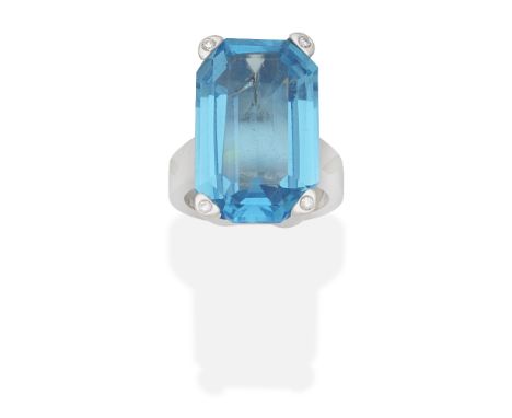 BLUE TOPAZ AND DIAMOND RINGOctagonal step-cut blue topaz and brilliant-cut diamonds, ring size approx. M½ For further informa