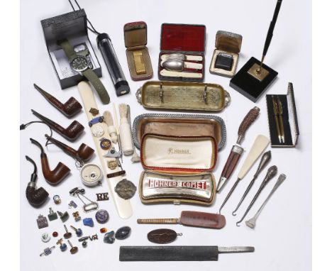 A collection of miscellaneous including a mouth organ by Hohner, a Dunhill cigarette lighter, a Victorian ivory page turner, 