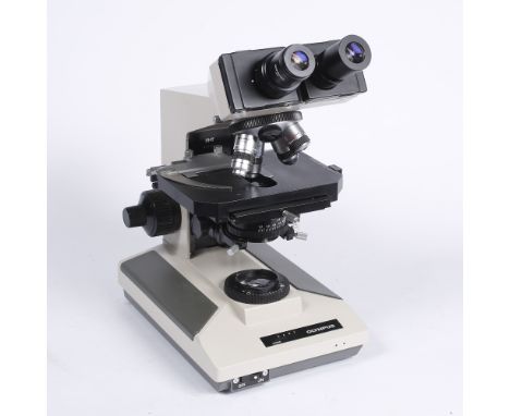 An Olympus 'Kyowa' electric illuminated binocular microscope 38cm high