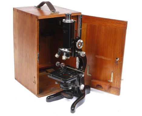 A W. Watson 'Bactil' monocular microscope with wooden case and further lenses