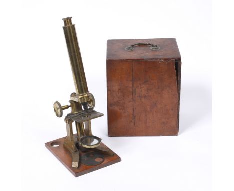A brass monocular microscope with fitted wooden case, 21cm high