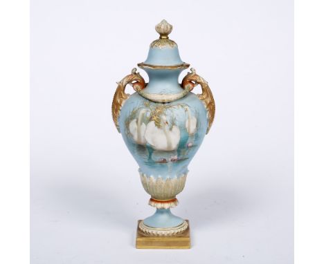 A Royal Worcester porcelain two handled vase and cover painted with swans and flying geese, by CHC (Charley) Baldwyn, signed,