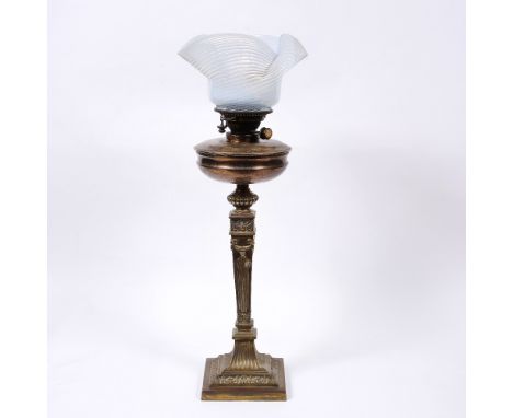 A Victorian brass column oil lamp with vaseline shade, 72cm high