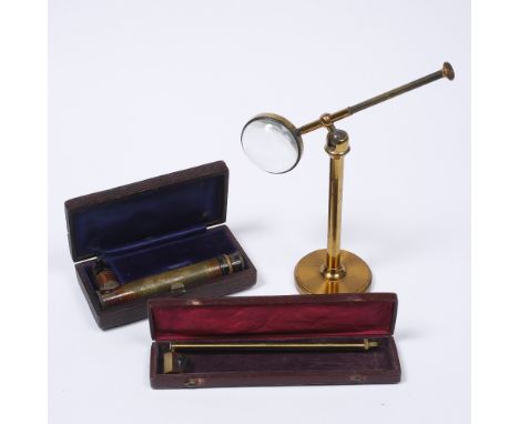 A brass bullseye condenser lens microscope accessory together with a cased brass spectroscope by A Hilger and cased brass cam