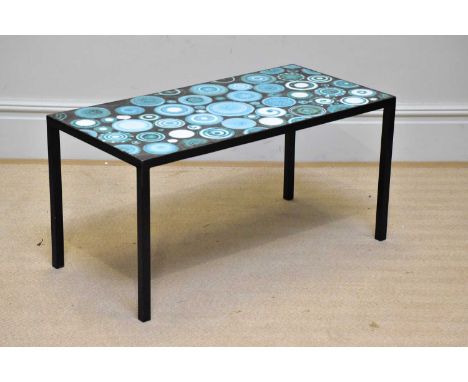 † CLIVE BROOKER; a studio pottery rectangular table top, decorated with stylised circles, on a black metal frame, length 91cm
