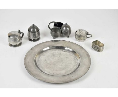 ARCHIBALD KNOX FOR TUDRIC PEWTER; an Arts &amp; Crafts napkin ring in the 0920 pattern and similar lidded mustard pattern 034