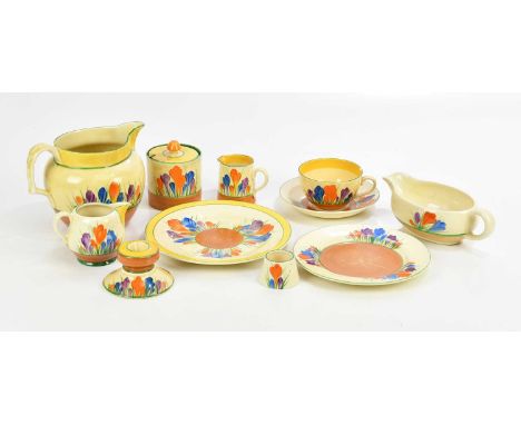 CLARICE CLIFF; a collection of ceramics decorated in the 'Crocus' pattern including preserve jar and cover, squat candlestick