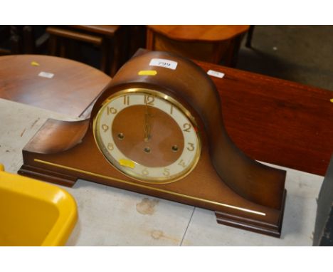 A three hole mantel clock