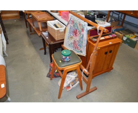 A tapestry frame together with a stool and a quantity of various relating items