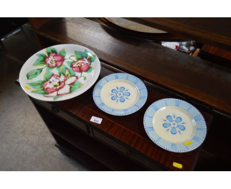 Three Clarice Cliff floral decorated plates